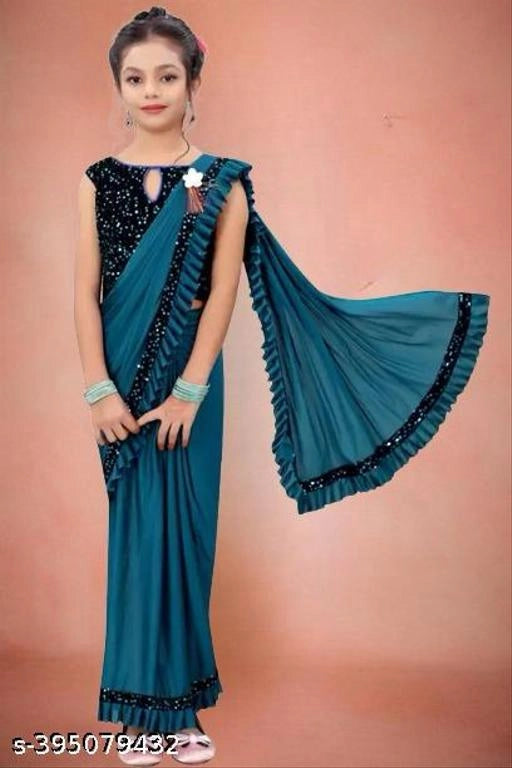 Lycra Solid Saree for Girls (Teal, 3-4 Years)Beautiful and comfortable lycra solid saree for girls aged 3–4 years. Soft, stretchable, and perfect for festivals, parties, and special occasions.