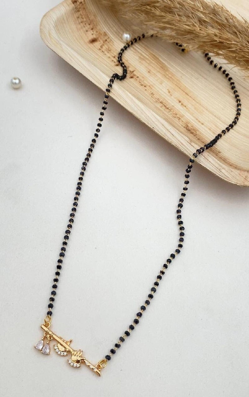 Gold-plated mangalsutra featuring a pendant with a Lord Krishna motif