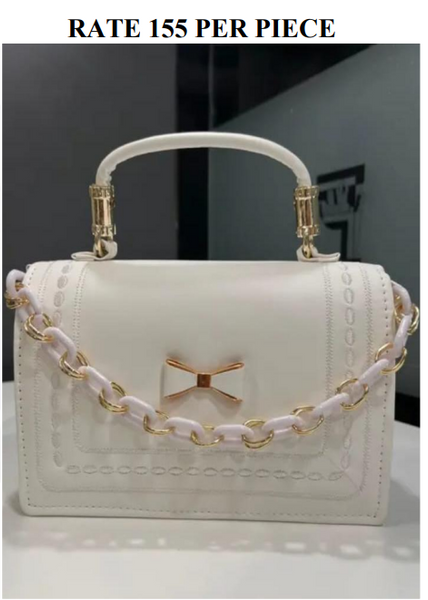 A delicate white bow with a gold-toned center is placed Handmade Handbag for Girls//தங்க நிற மையத்துடன் கூடிய மென்மையான வெள்ளை வில் வடிவமைப்புடன் கூடிய, கைகளால் செய்யப்பட்ட, பெண்களுக்கான கைப்பை.
