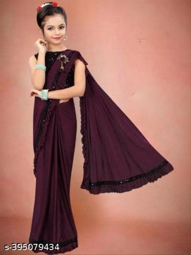 Lycra Solid Saree for Girls (Wine, 7-8 Years).Elegant and comfortable lycra solid saree for girls aged 7–8 years. Soft, lightweight, and perfect for parties, festivals, and special occasions.