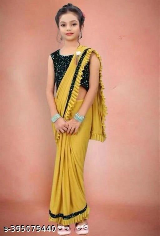 Lycra Solid Saree for Girls (Mustard, 4-5 Years).Elegant and comfortable lycra solid saree for girls aged 4–5 years. Soft, stretchable, and perfect for festivals, parties, and special occasions.